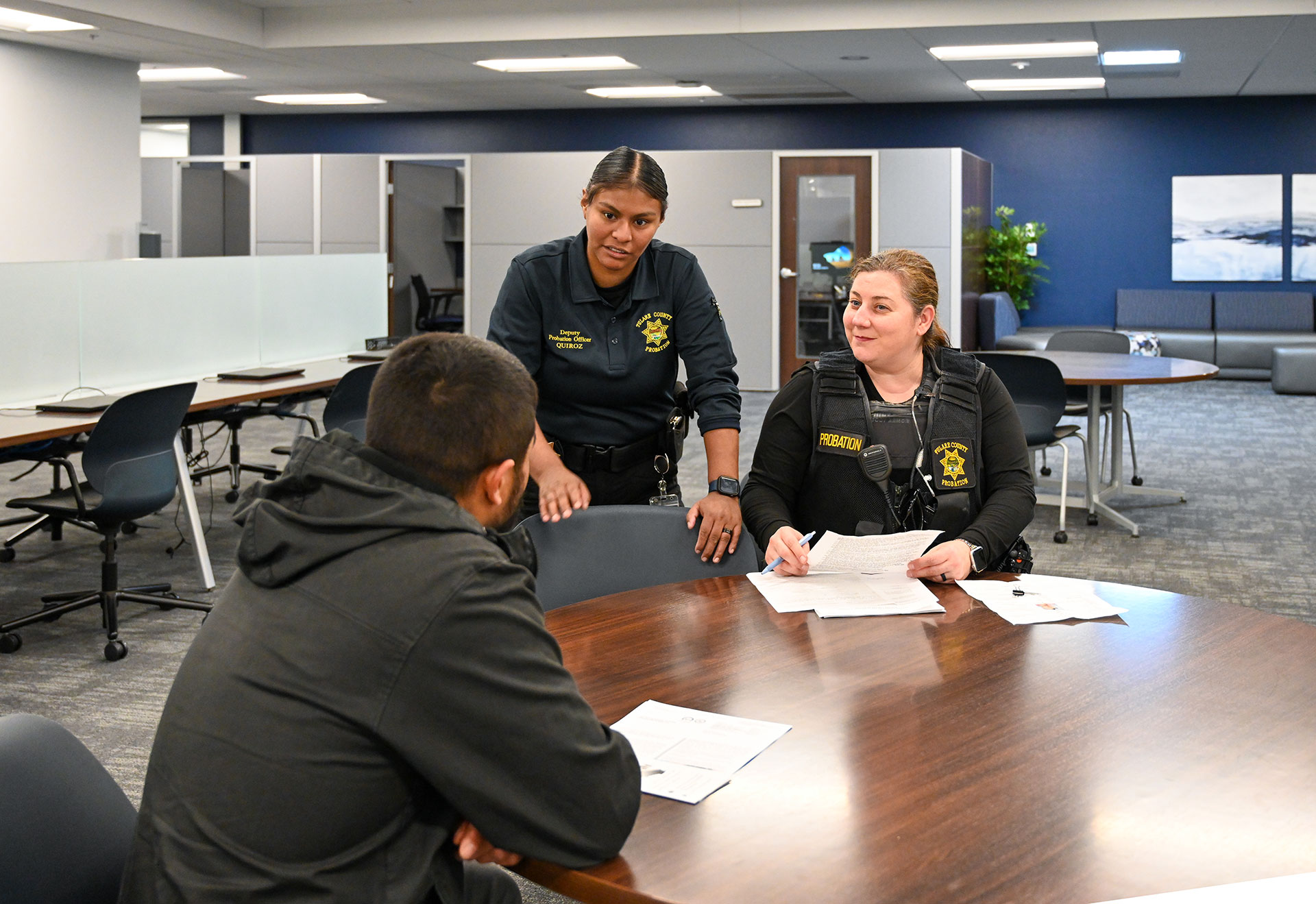 Officer working with client